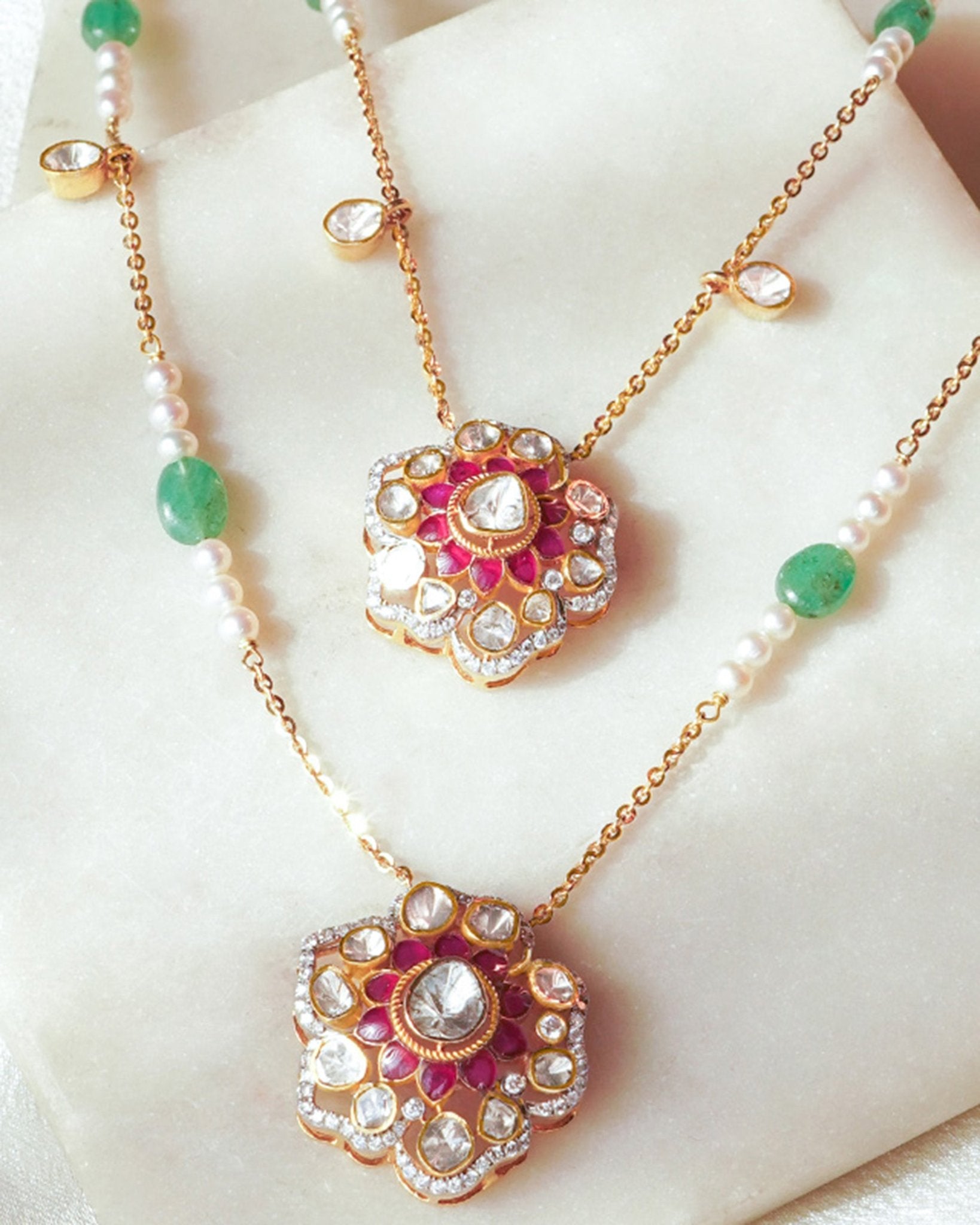 14K gold necklace with floral Polki pendants and emerald beads