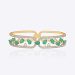 14K gold bracelet with emerald and diamond vine-leaf detailing.