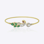 Elegant 9K gold bracelet with curved emerald detailing, sparkling diamonds, and radiant Polki centerpiece