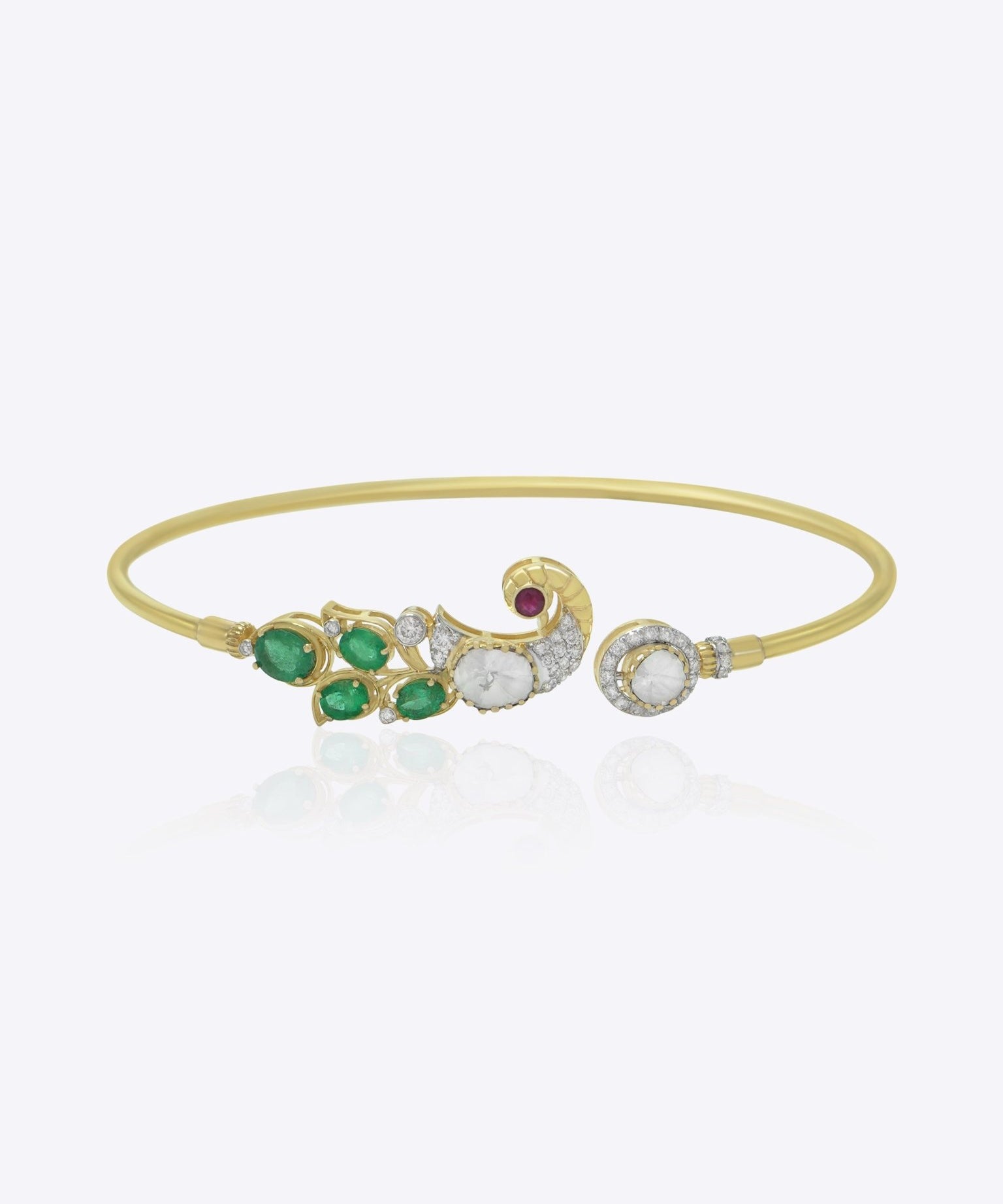 Elegant 9K gold bracelet with curved emerald detailing, sparkling diamonds, and radiant Polki centerpiece