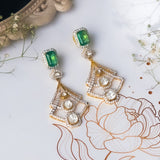 14K gold earrings with a geometric, fluid design