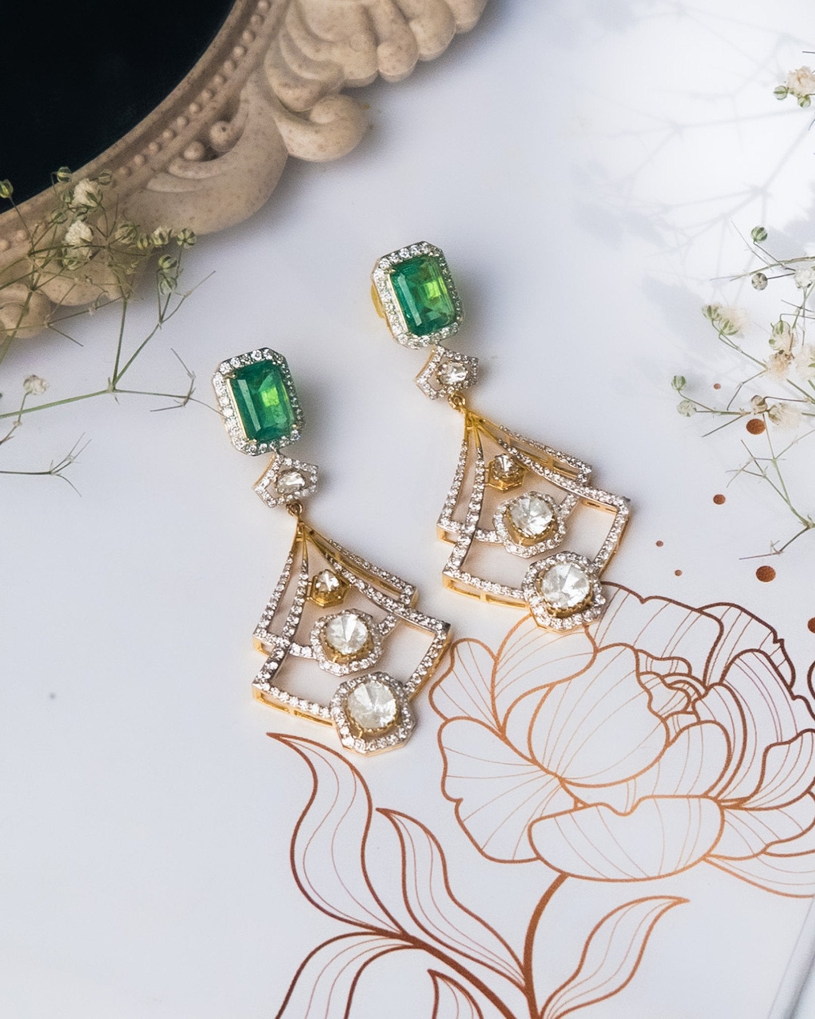 14K gold earrings with a geometric, fluid design