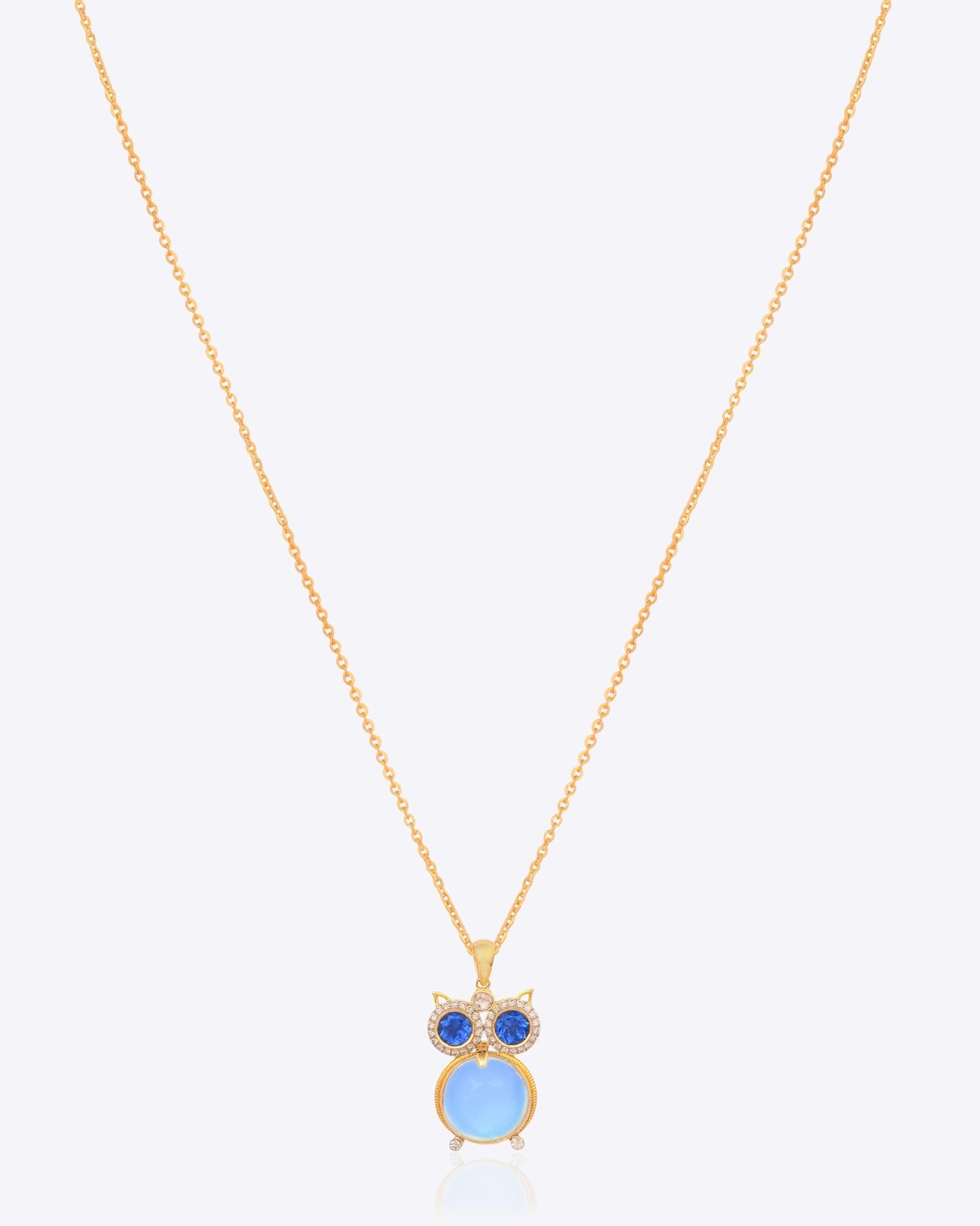 14K gold owl-inspired pendant with Polki diamonds and blue gemstones.