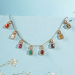 Heritage Hue Necklace in 14K gold with nine rectangular gemstones and Polki diamonds.
