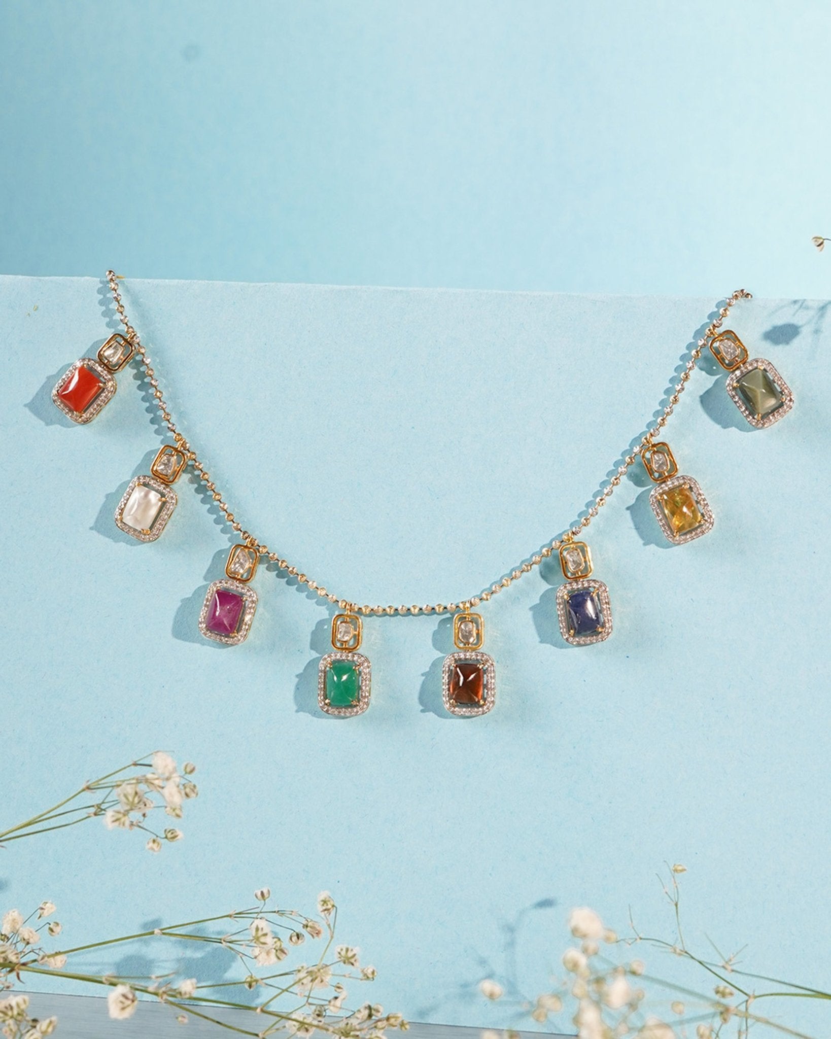 Heritage Hue Necklace in 14K gold with nine rectangular gemstones and Polki diamonds.