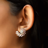 14K gold curved stud earrings with blush gemstones and Polki diamonds.