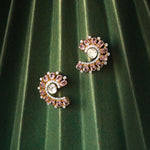 14K gold curved stud earrings with blush gemstones and Polki diamonds.