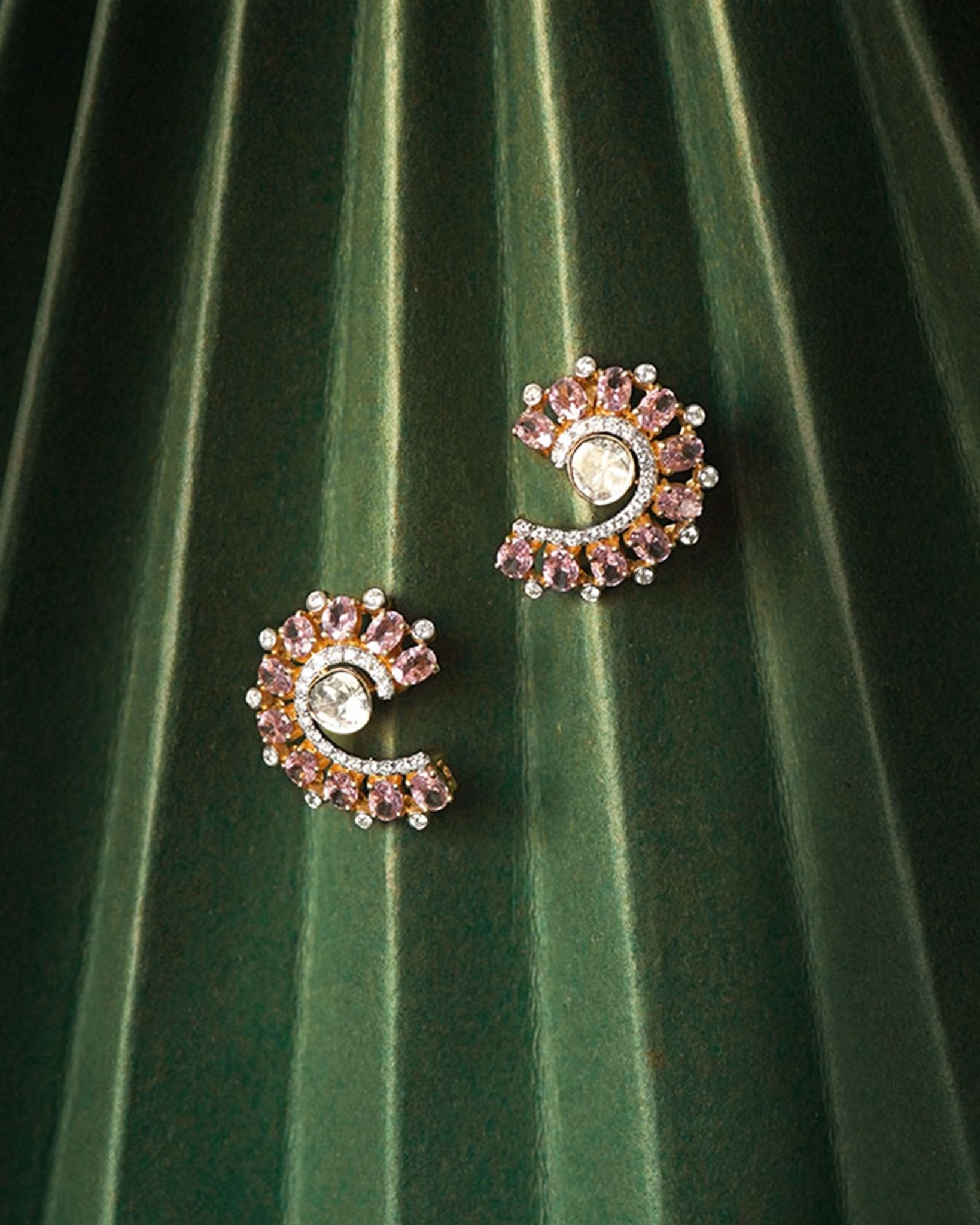 14K gold curved stud earrings with blush gemstones and Polki diamonds.