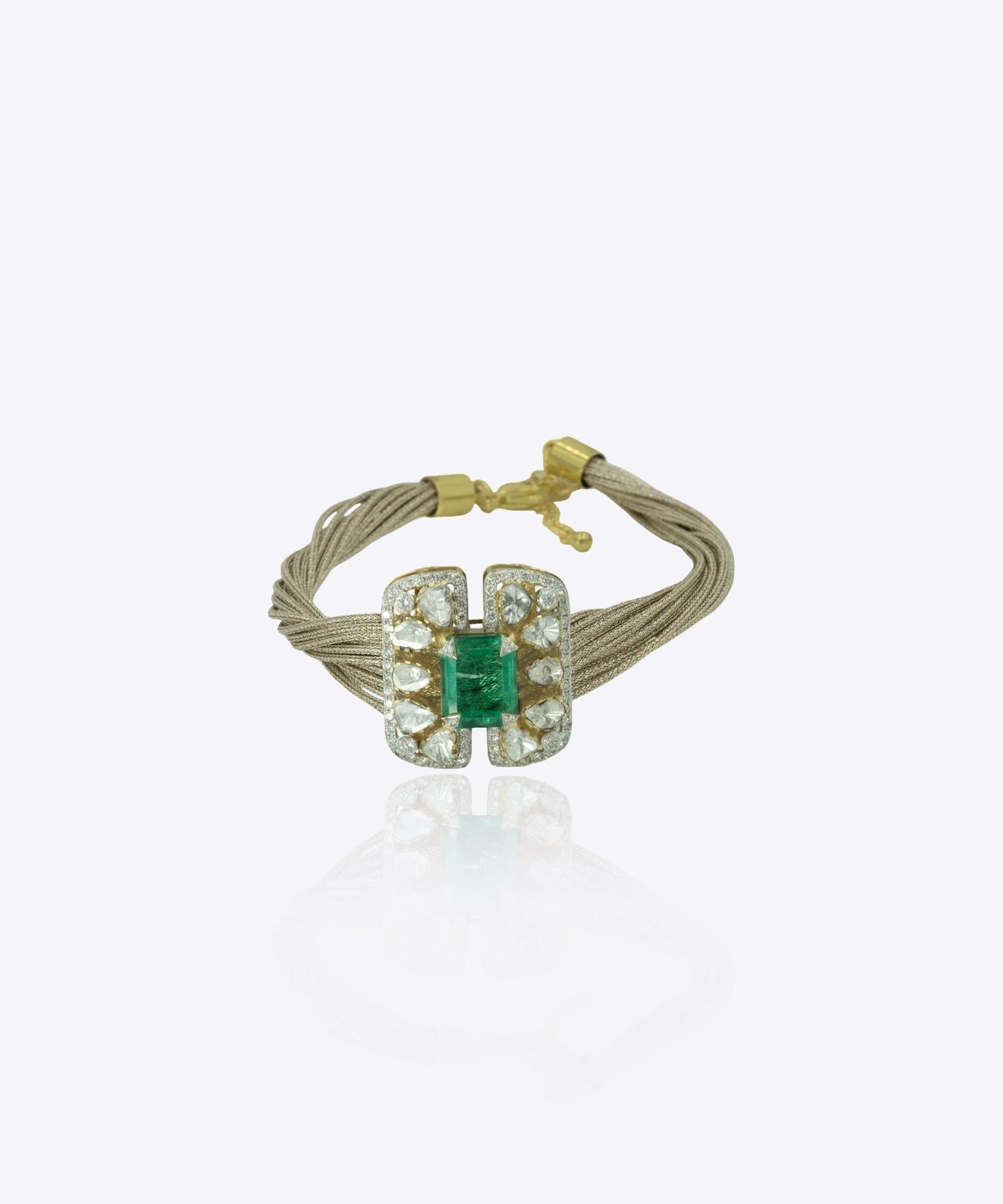 9k gold Glinting Hive bracelet with rectangular emerald centerpiece and refine Polki wings