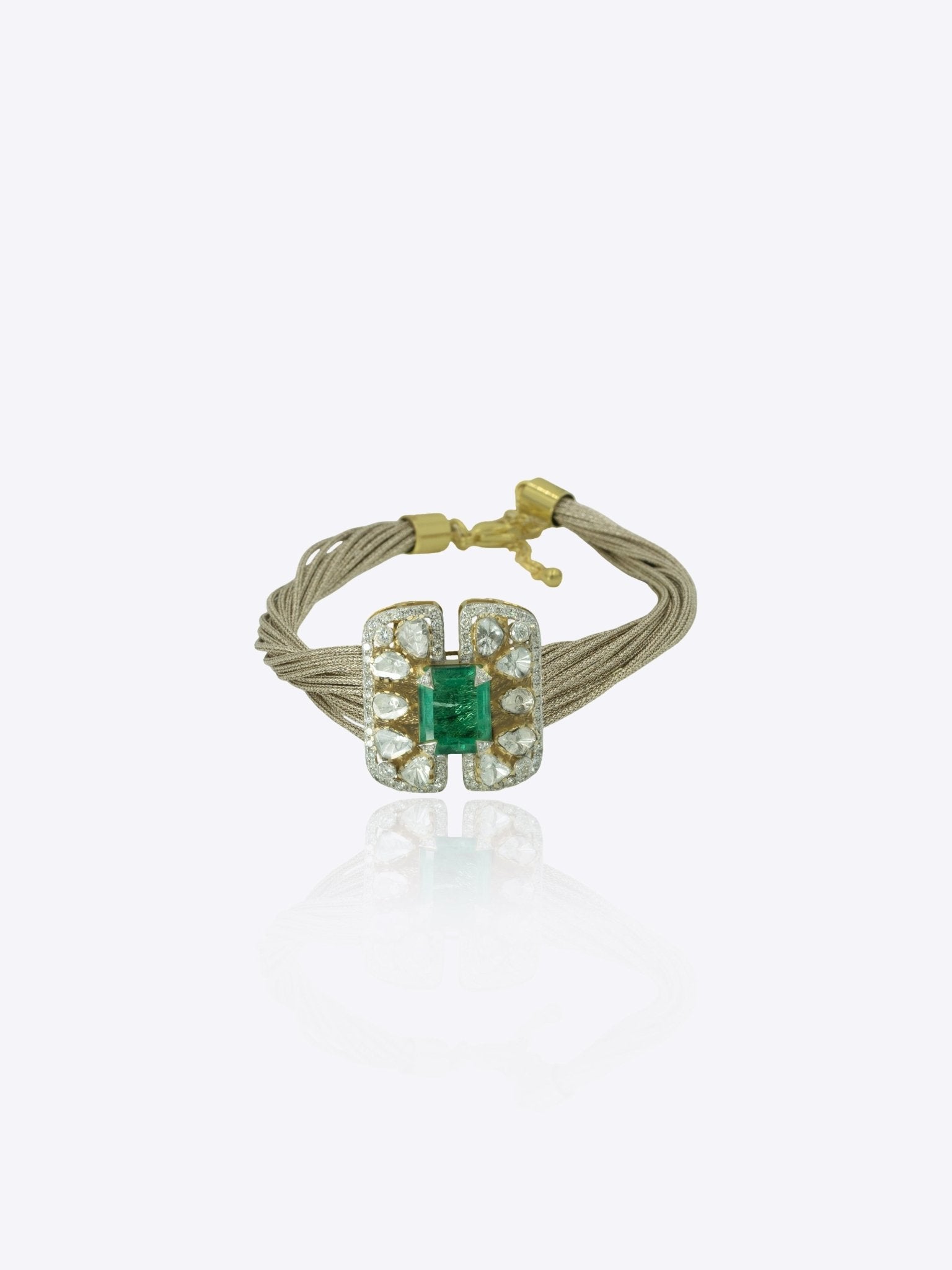9k gold Glinting Hive bracelet with rectangular emerald centerpiece and refine Polki wings