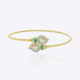 9K gold open ended bracelet featuring twin mango silhouettes with clear uncut stones.