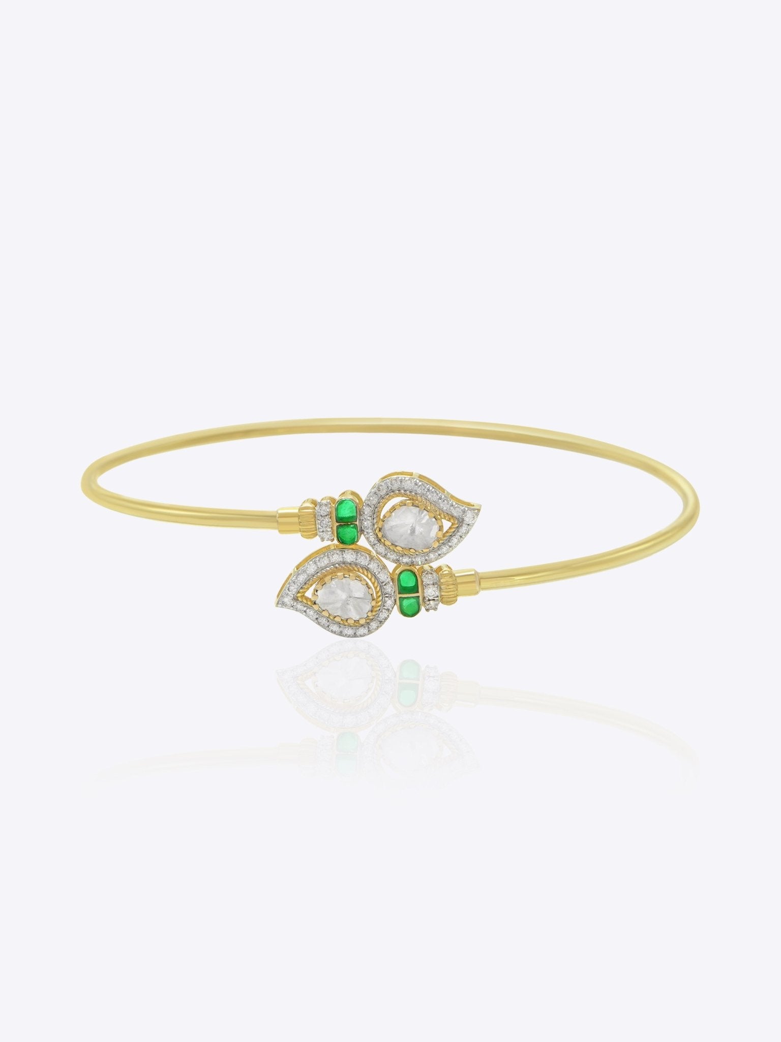 9K gold open ended bracelet featuring twin mango silhouettes with clear uncut stones.