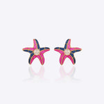 Stellar Starfish Earrings in 14K gold with uncut Polki diamonds in pink and blue.