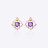 9k gold Orchid Halo earrings with soft curves and violet center stone