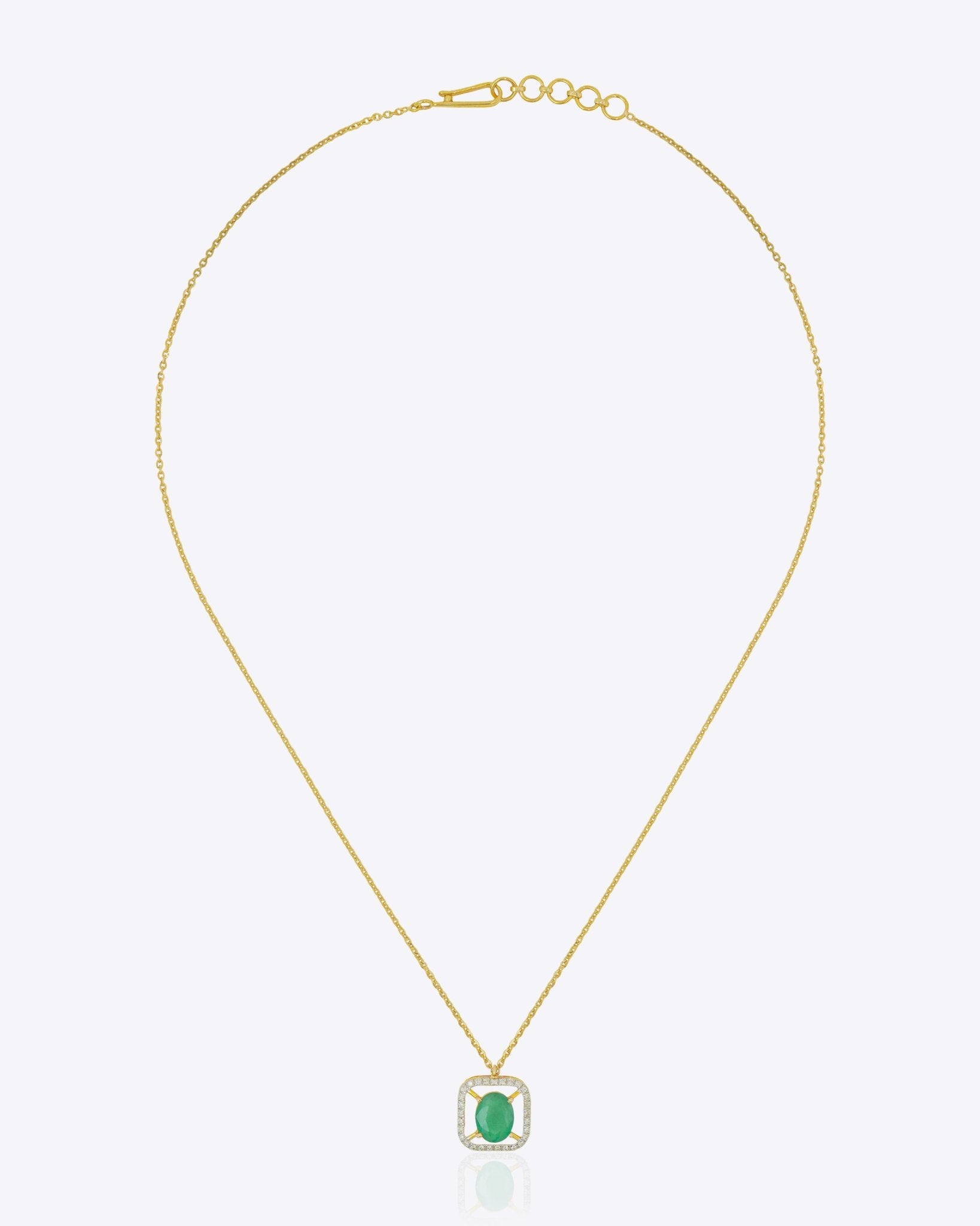 14K gold pendant with a vivid emerald in a clean geometric design