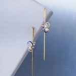 14k gold Mystic Wing earpins with Polki, diamonds, and tanzanite in a butterfly-wing design.