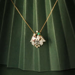 14K gold pendant with Polki, pastel gemstones, and diamond droplets