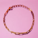 18K solid gold paper clip chain bracelet, shown worn solo for an everyday minimal look.