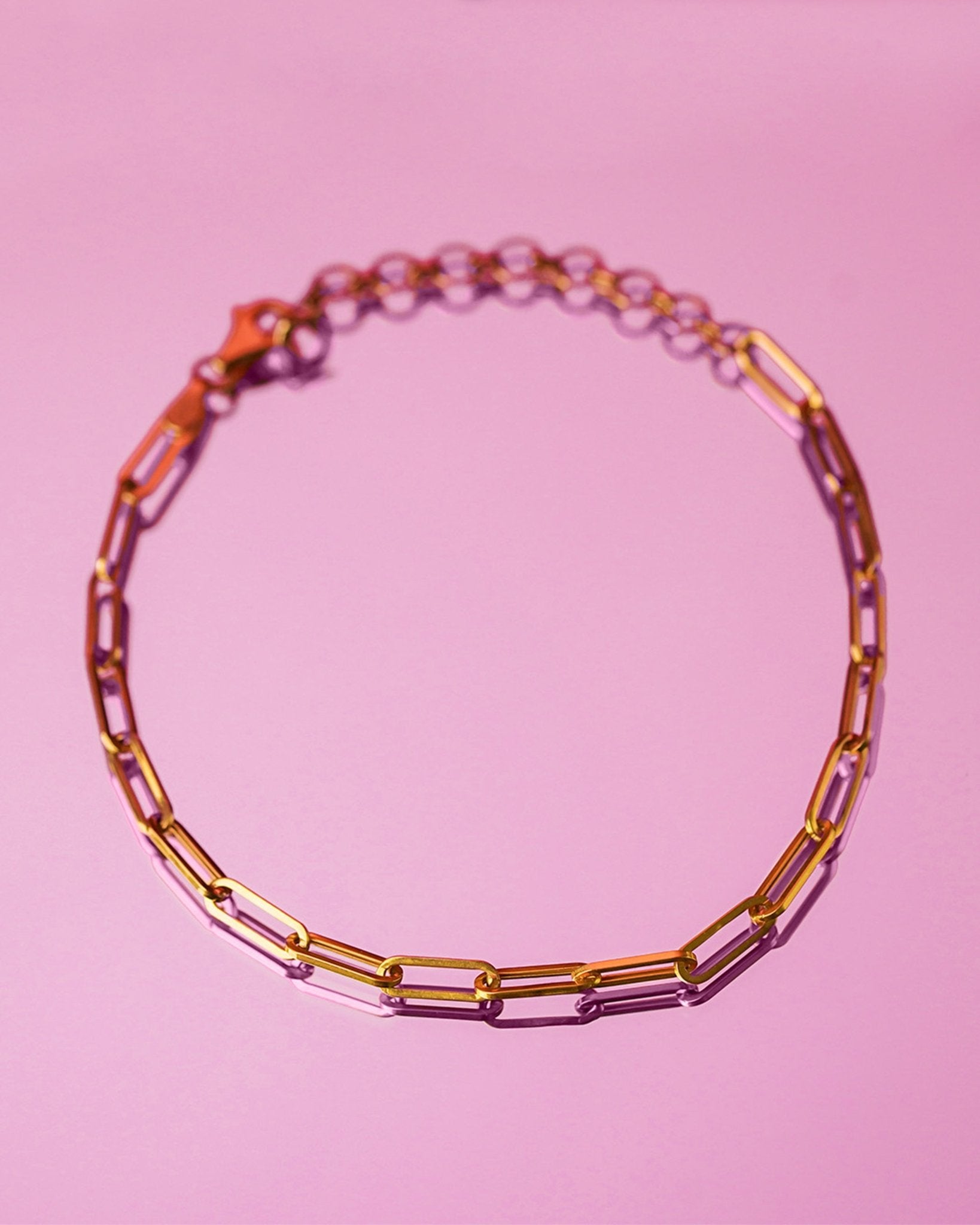 18K solid gold paper clip chain bracelet, shown worn solo for an everyday minimal look.