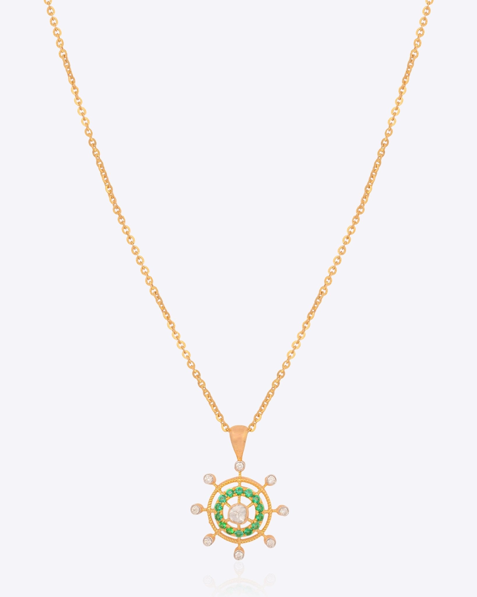 Whimsy Wheel Pendant in 14K gold with vibrant green centrepiece and Polki diamond spokes.