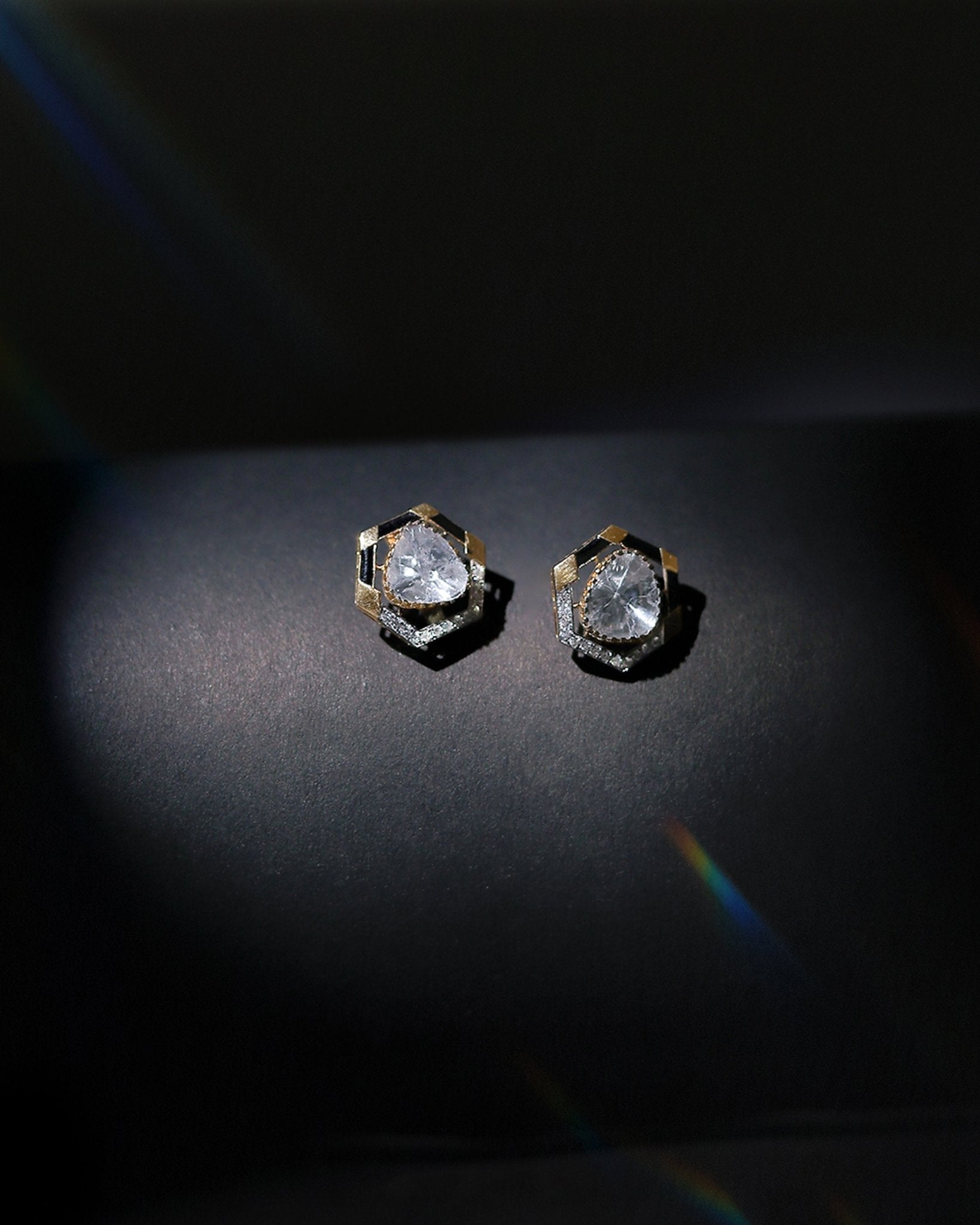 Ringlet Polki Studs in 14K gold with an oval polki and gold halo