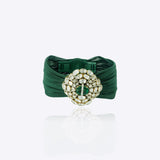 9k gold fine bracelet with emerald oval medallion and Polki cluster detailing