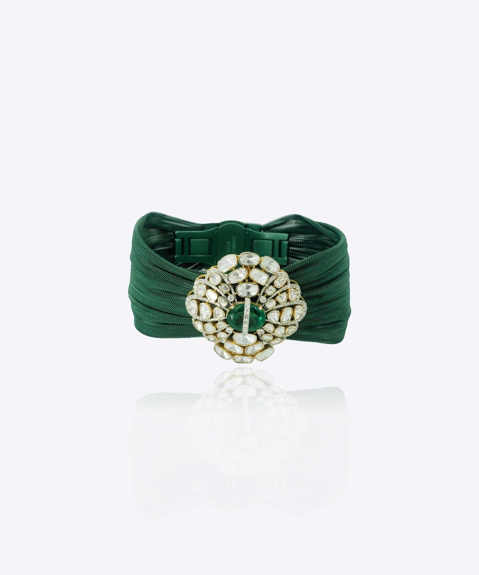 9k gold fine bracelet with emerald oval medallion and Polki cluster detailing