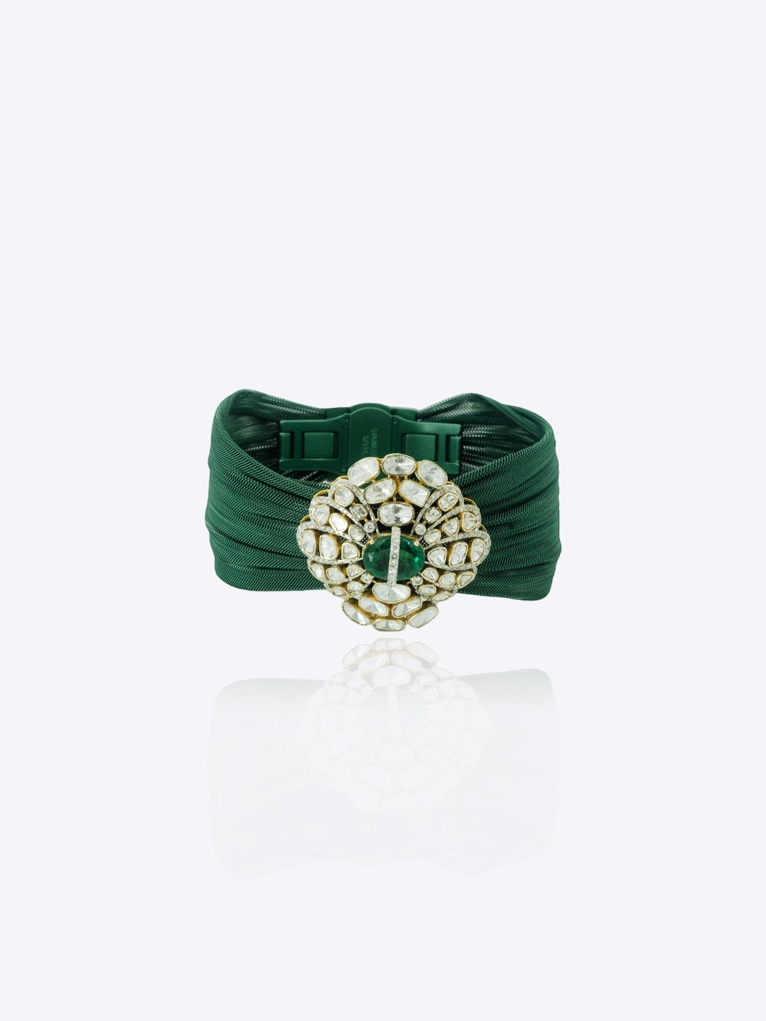 9k gold fine bracelet with emerald oval medallion and Polki cluster detailing