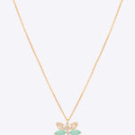 14k gold dragonfly pendant with Polki, diamonds, and green stones