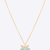 14k gold dragonfly pendant with Polki, diamonds, and green stones