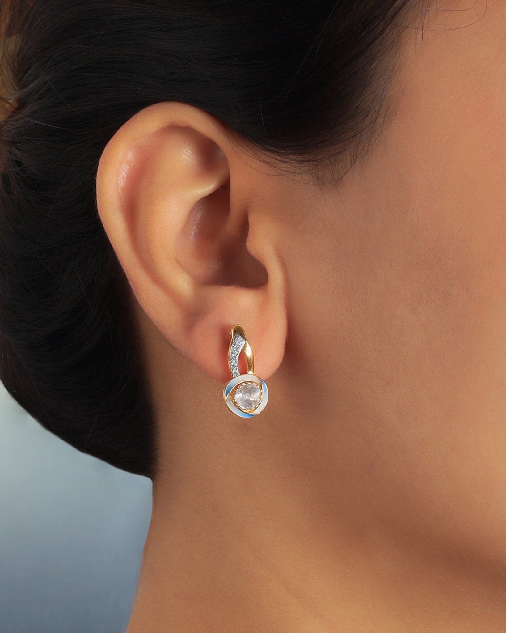 Seren Arc Earrings in 14K gold with a diamond and polished-gold curved design
