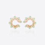 14k gold stud earrings with green gemstones, Polki, and diamonds.
