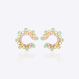 14k gold stud earrings with green gemstones, Polki, and diamonds.