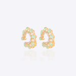 14k gold stud earrings with green gemstones, Polki, and diamonds.