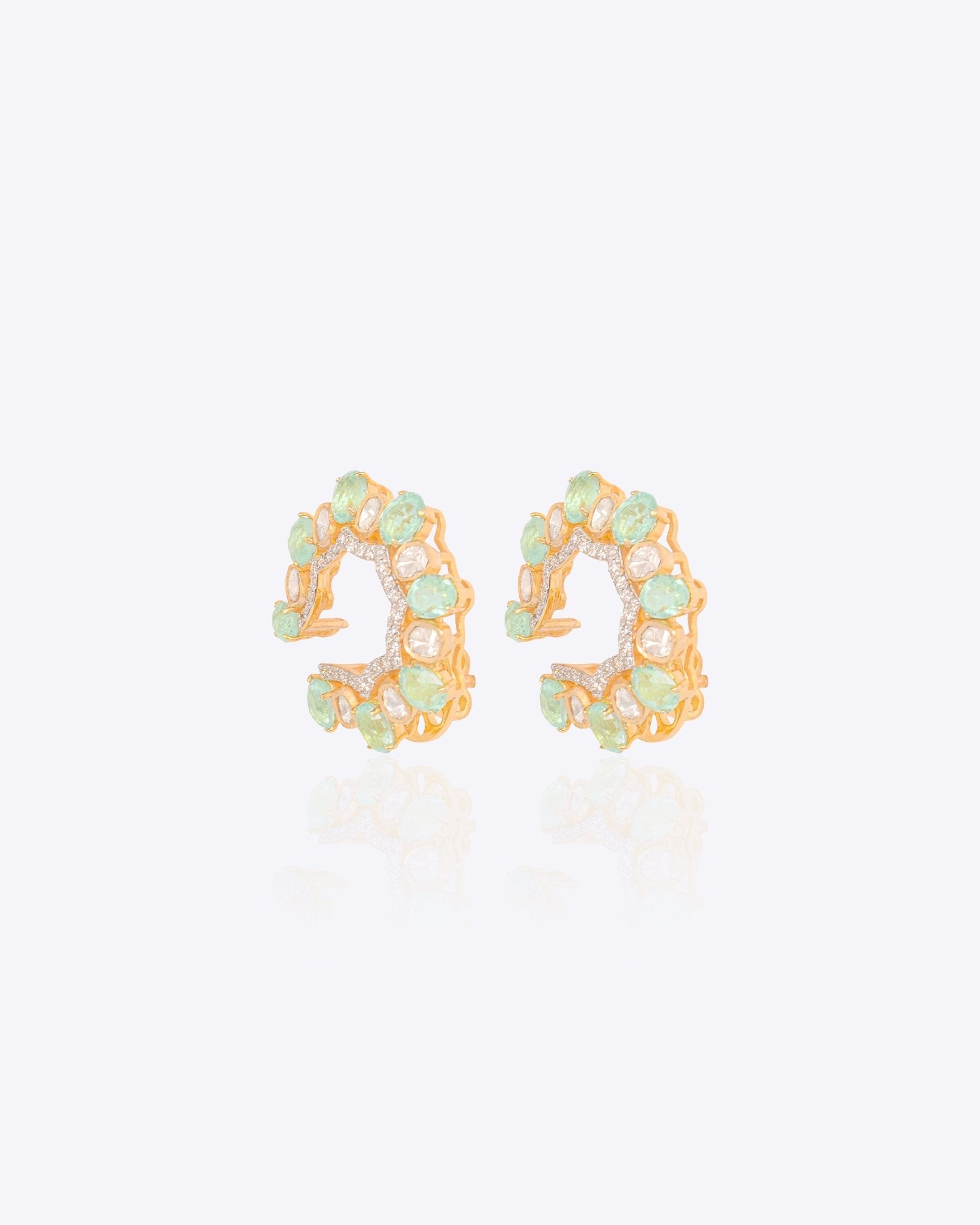 14k gold stud earrings with green gemstones, Polki, and diamonds.