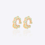 14k gold stud earrings with green gemstones, Polki, and diamonds.