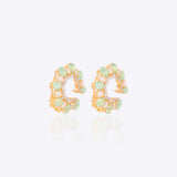 14k gold stud earrings with green gemstones, Polki, and diamonds.