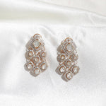 Sundown Flora Earrings in 18K gold with central Polki encircled by diamonds.