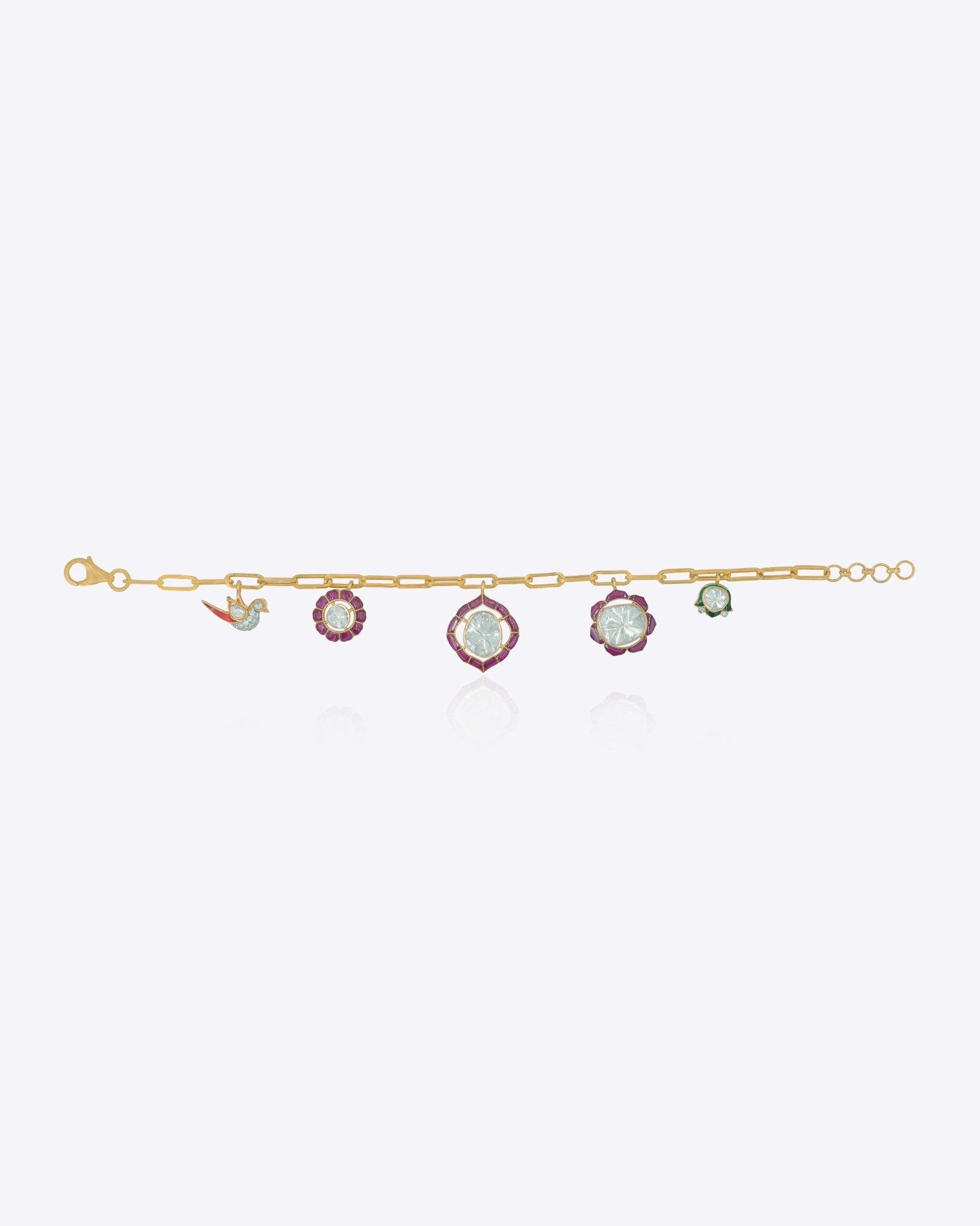 18K gold charm bracelet with floral motifs, talaf stones, and Polki accents.