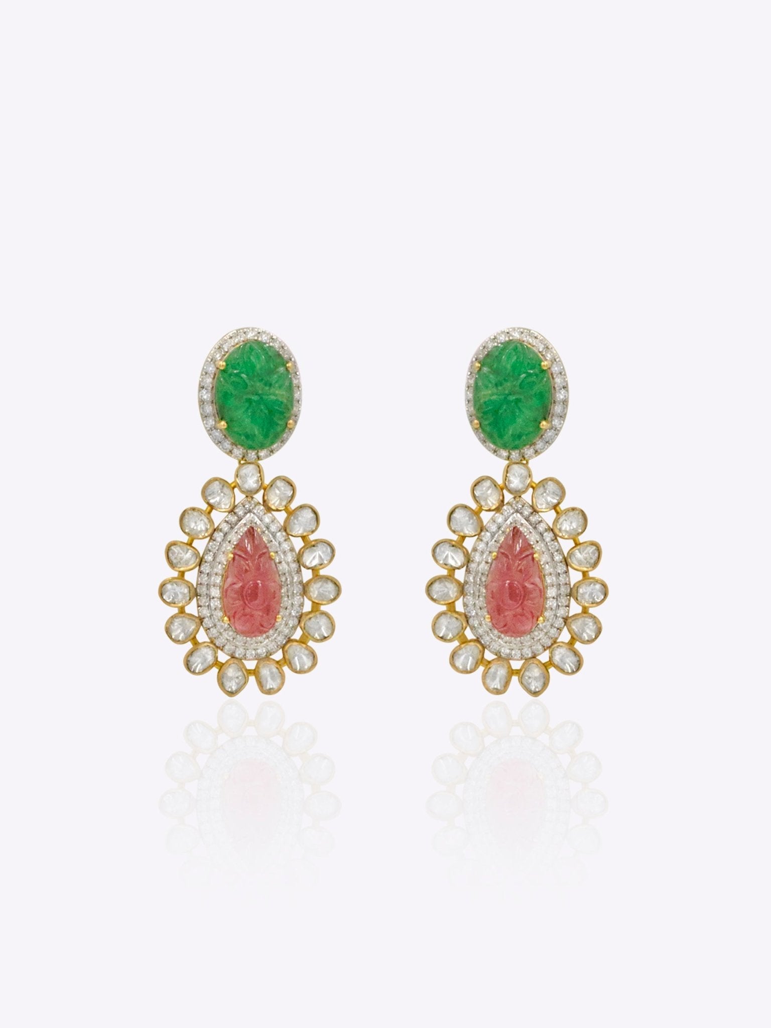 14k gold earrings with carved emerald studs and a ruby-encrusted pear motif.