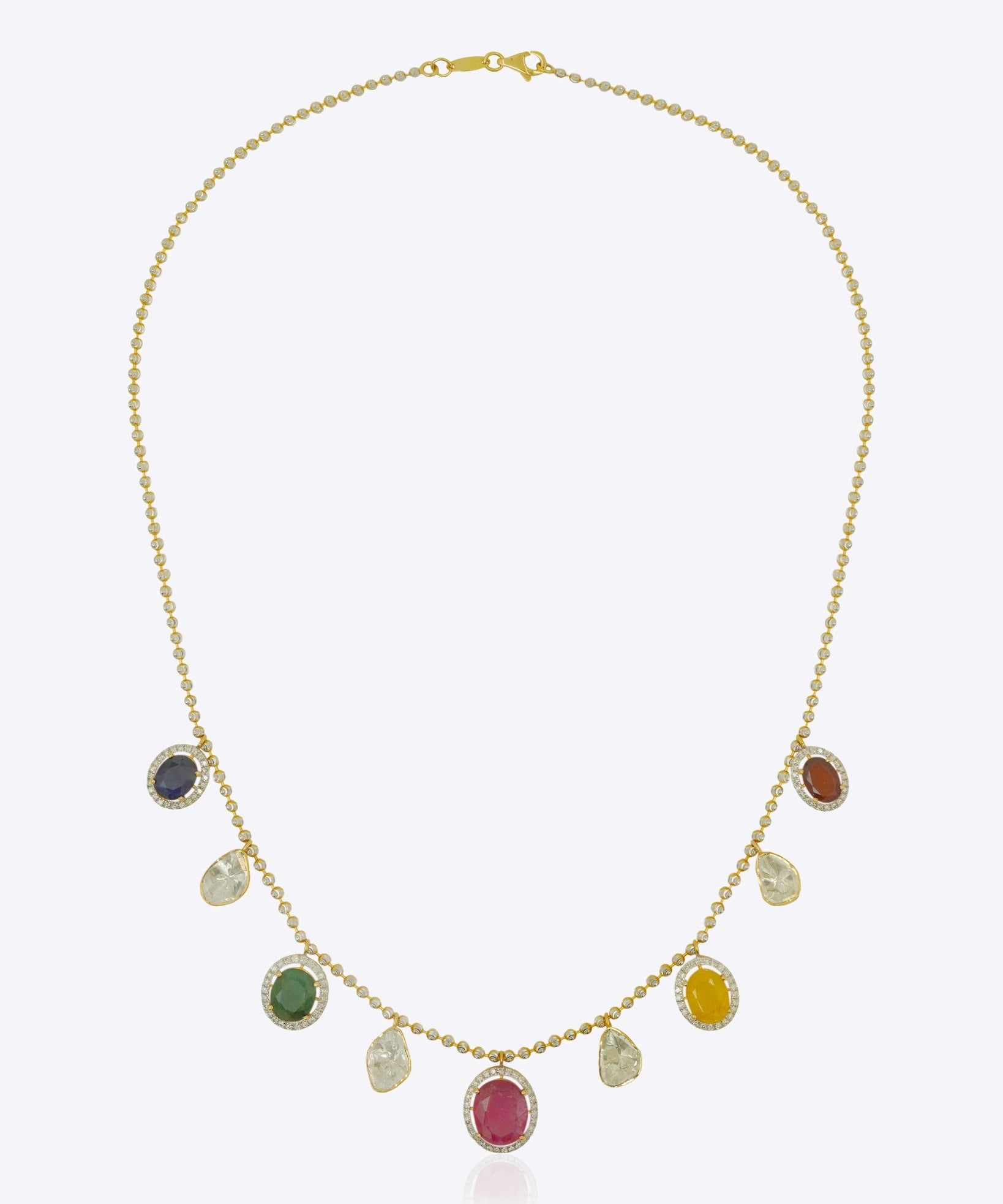 18K gold necklace with a graceful rhythmic design and a soft rosy tone.