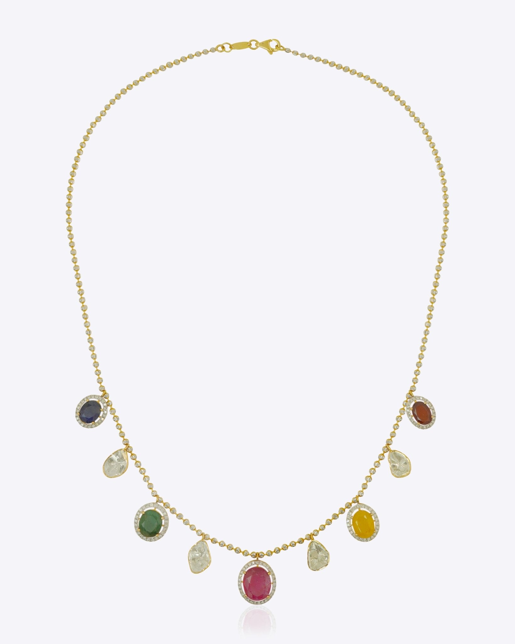 18K gold necklace with a graceful rhythmic design and a soft rosy tone.