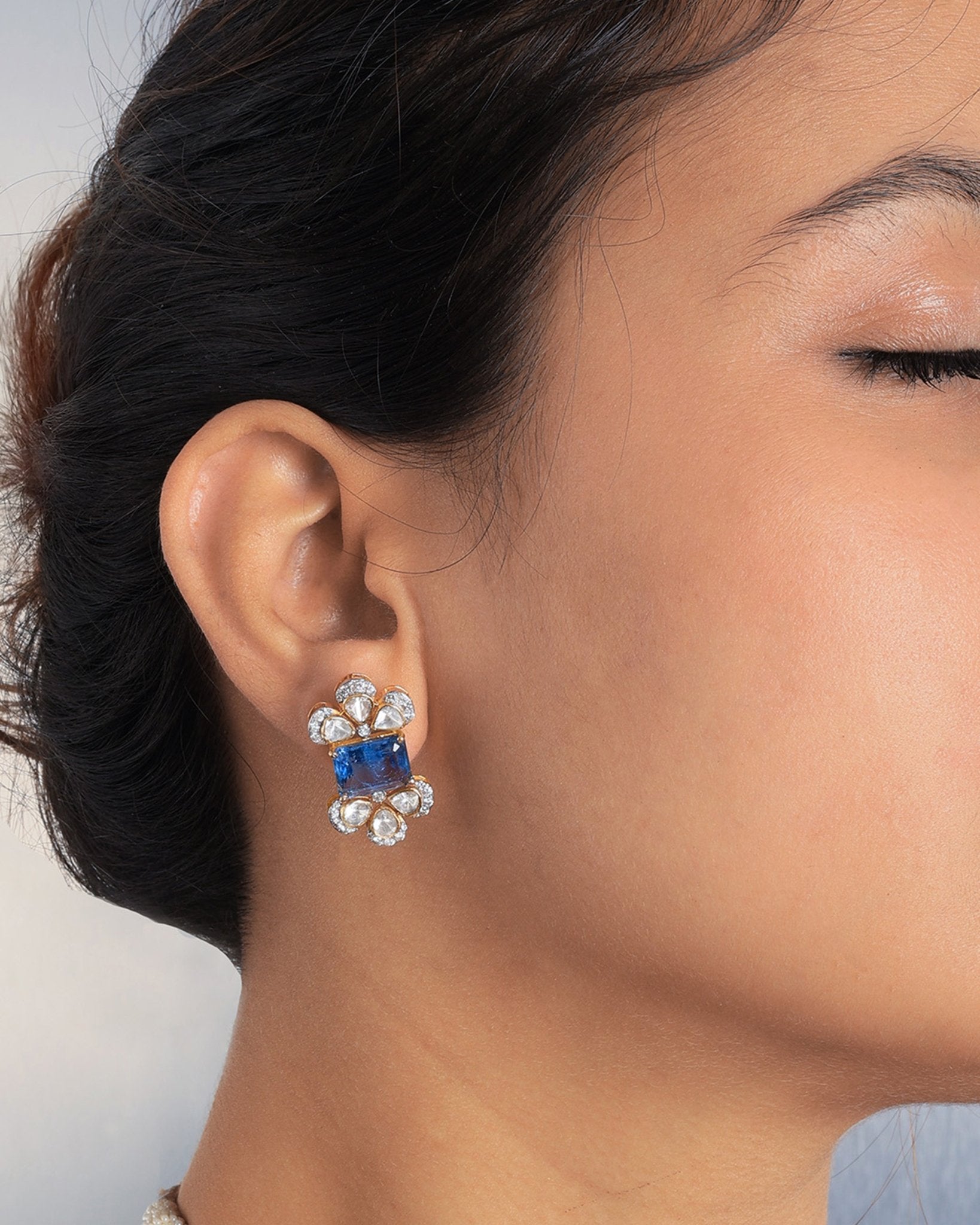 14K gold Noelle Bloom floral stud earrings with delicate detailing.