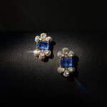 14K gold Noelle Bloom floral stud earrings with delicate detailing.