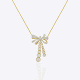 14kt gold necklace with delicate bow design and cascading drops