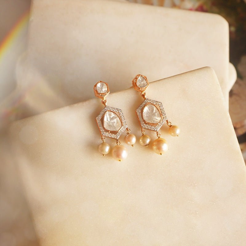 Jewelry image of pearl and polki fusion in wave-inspired frame.