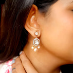 Model wears Harmony earrings with pearl-encrusted sari for poetic charm.