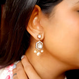 Model wears Harmony earrings with pearl-encrusted sari for poetic charm.