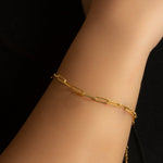 18K solid gold paper clip chain bracelet, shown worn solo for an everyday minimal look.