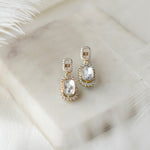 Dangling earrings with box-like shape and radiant diamond polki.